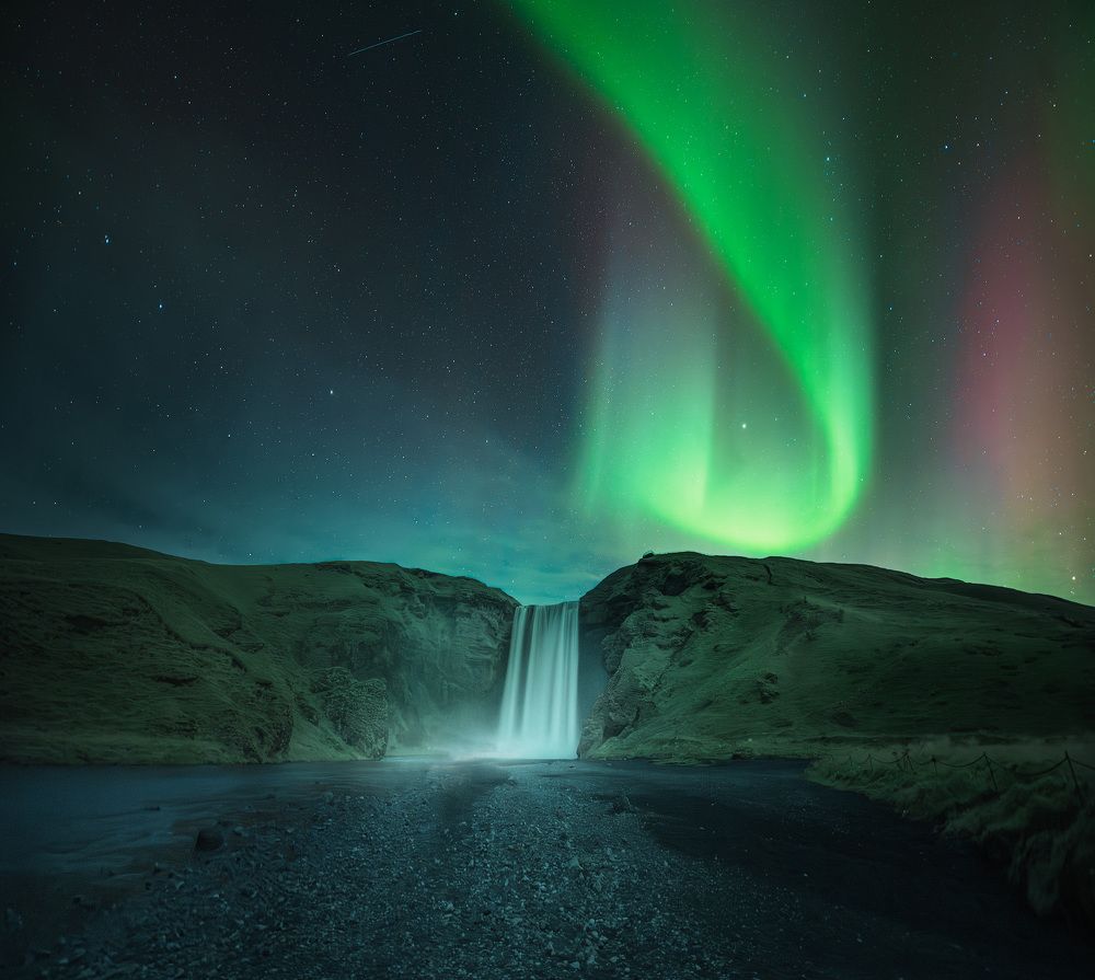 Majestic Aurora above the Waterfall