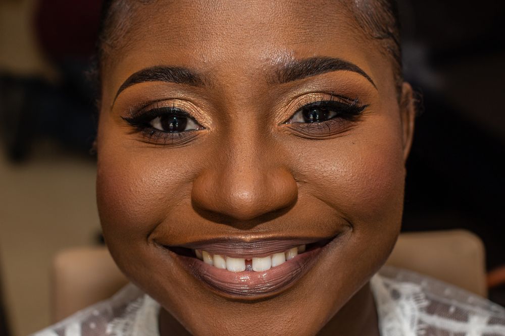 A photo of a black woman after a make-up session