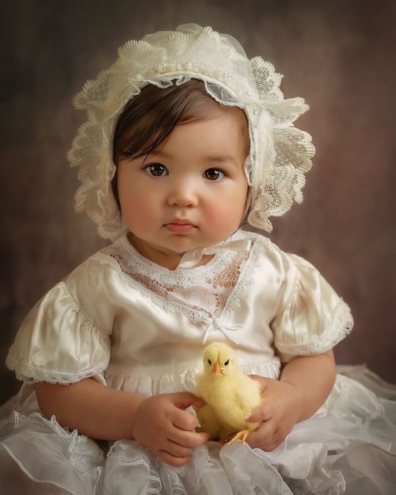Baby girl with baby chick