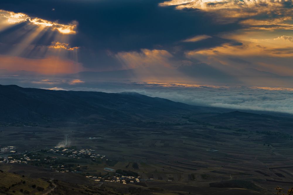 Sunset over the clouds
