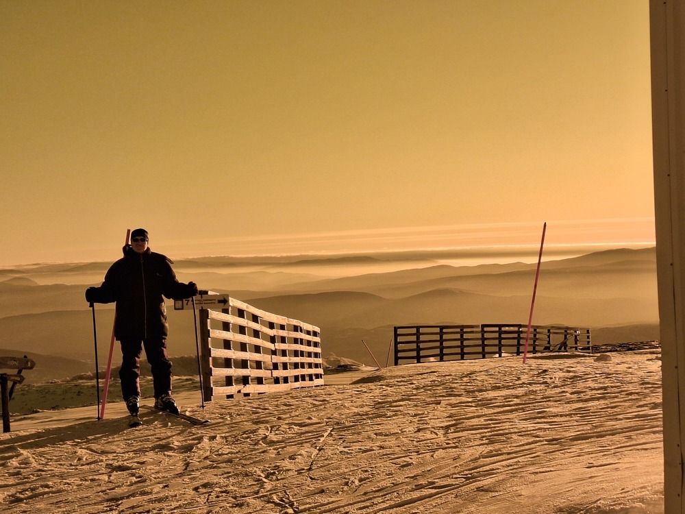 A man awake dreams on pillows of clouds.