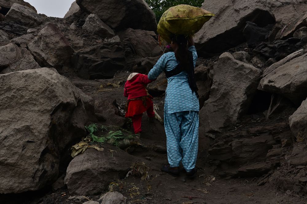 LOST CHILDHOOD IN THE DESPERATE STRUGGLE FOR SURVIVAL .