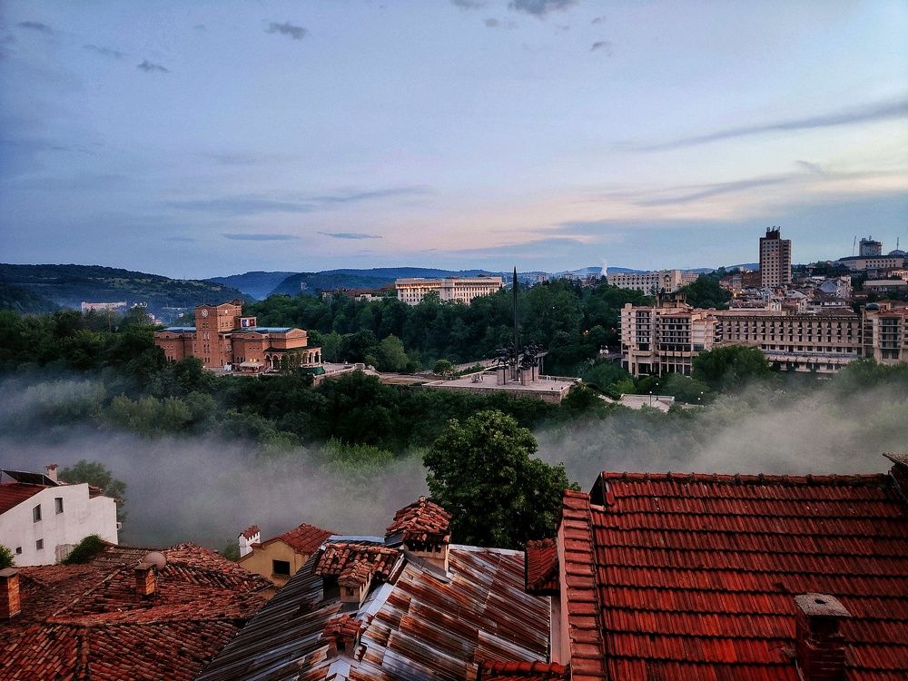 Foggy sunset evening over old town of Veliko Tarnovo