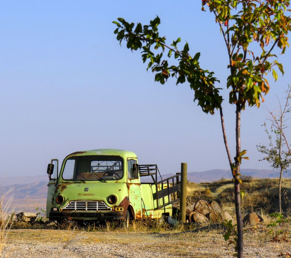 Abandoned rusty car in the Cappadocia valley