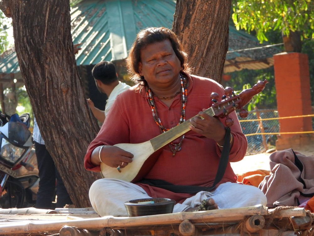 A tribal playing banjo