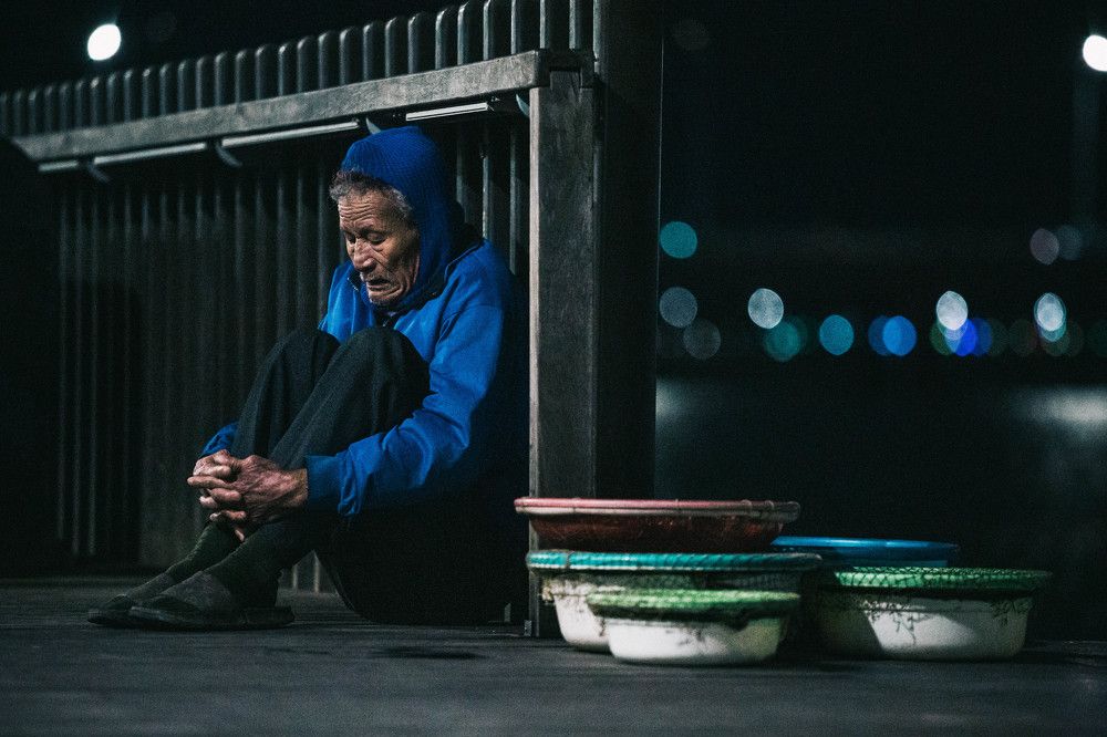 Poor elderly people in Vietnam in the winter