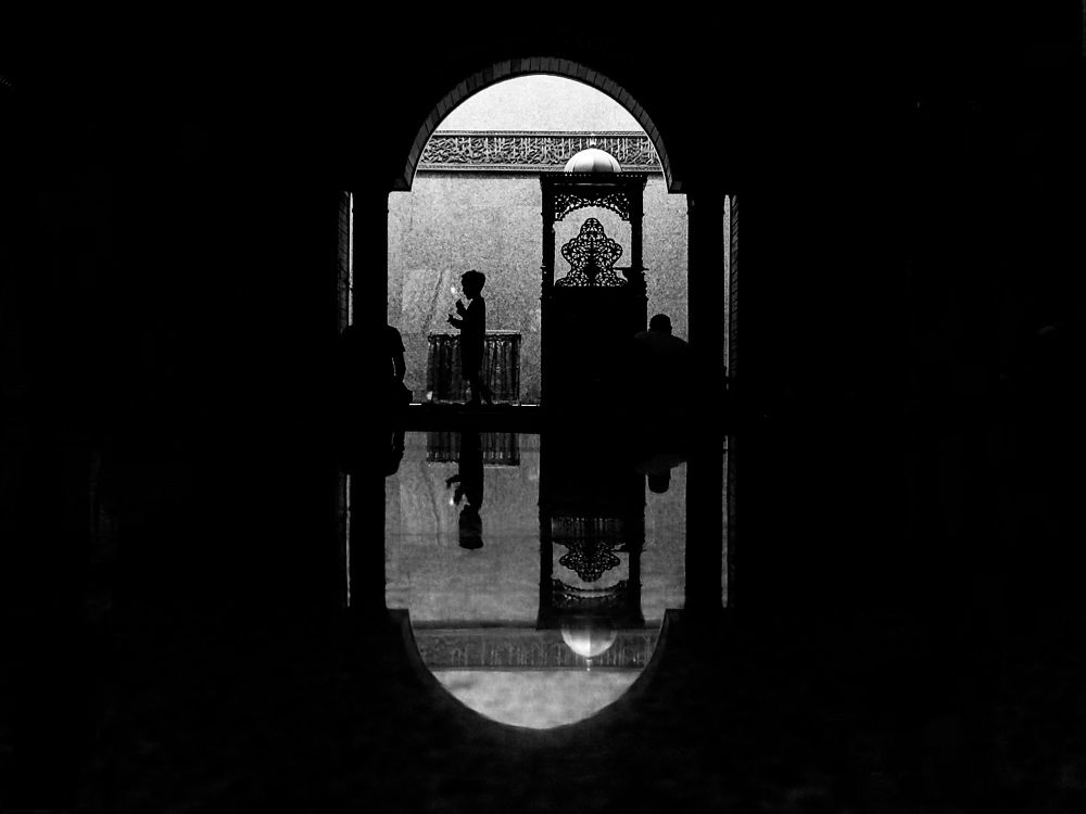 Small child in front of the pulpit of a mosque