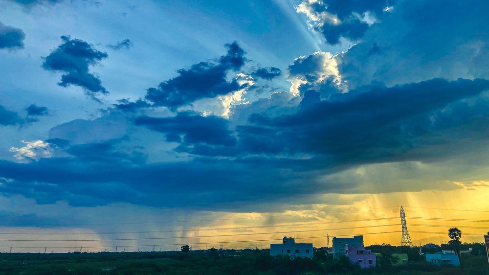 Golden Rays and Summer Storms: A Dramatic Sky over Madurai