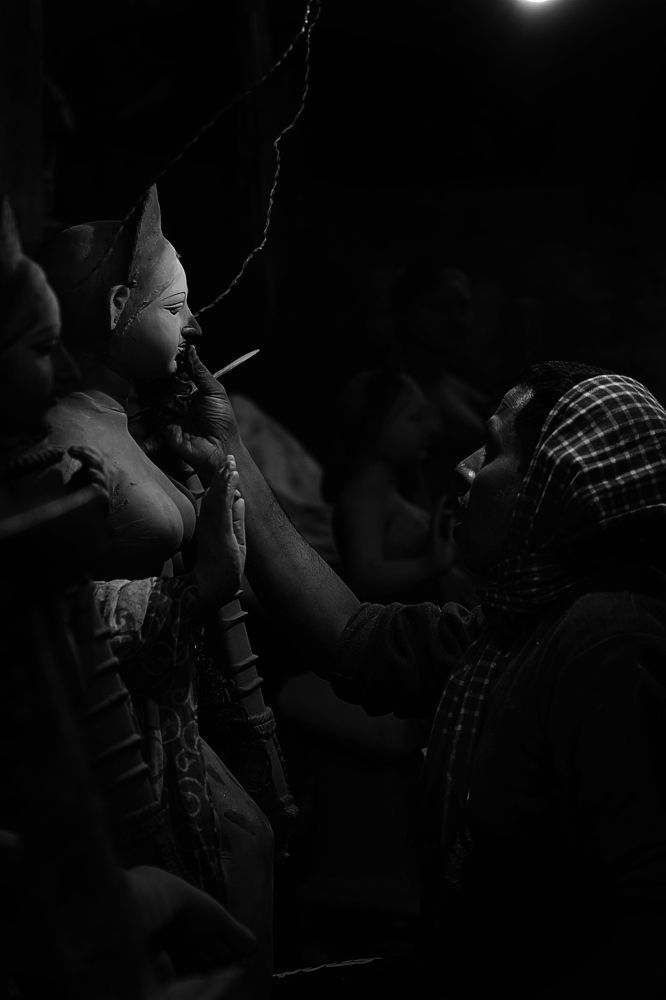 A potter breathing life into the divine.