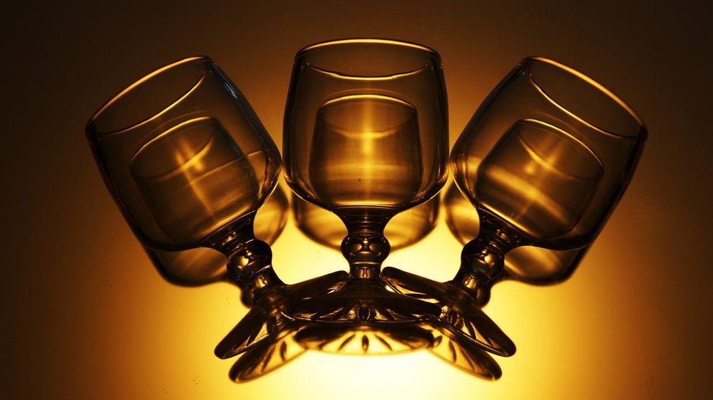 Surreal layered transparent glass still life with hypnotic curves