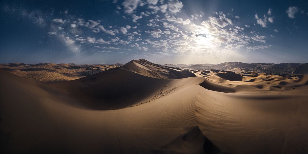 Moonlight tyndall and milky way shining in the desert