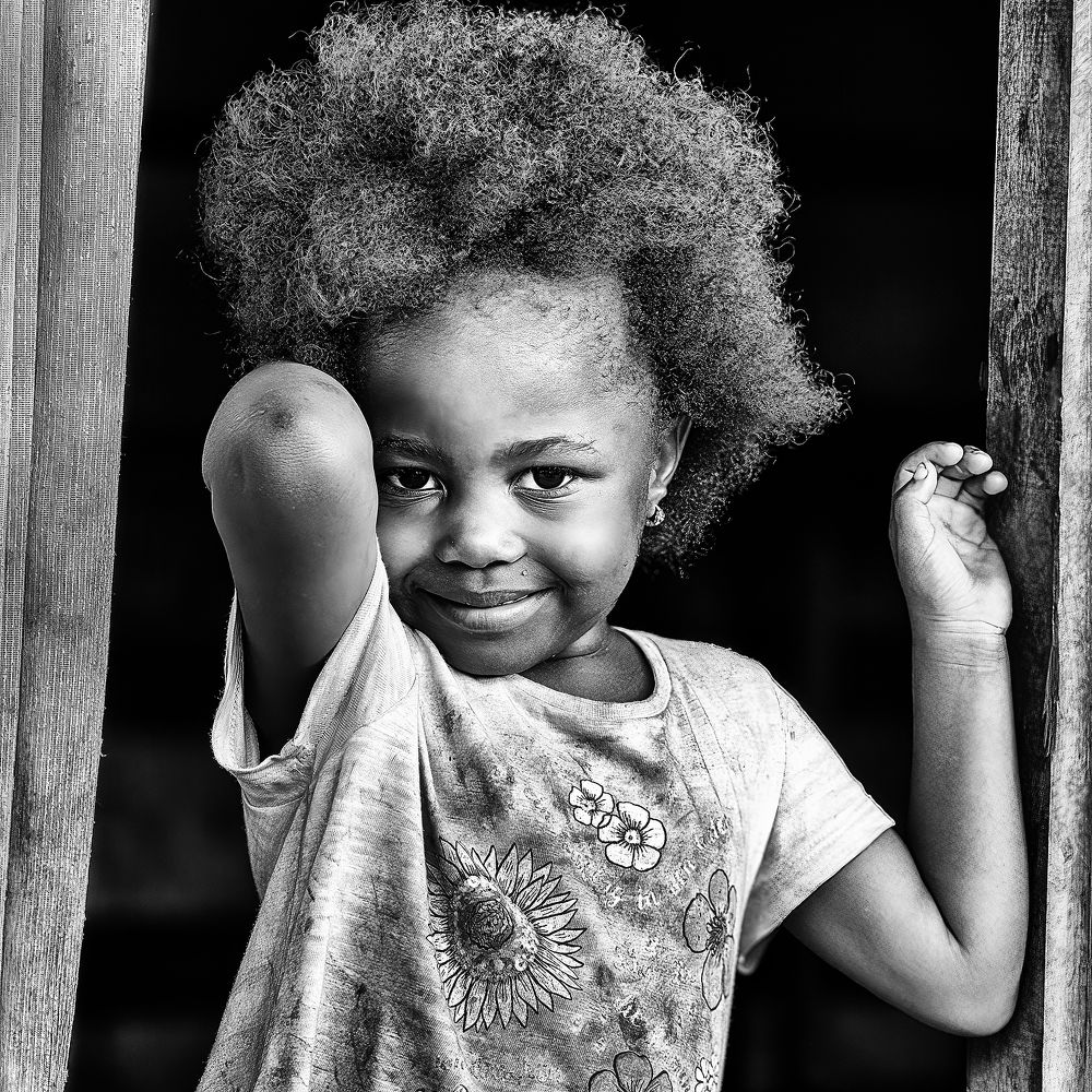 A BADJOUE YOUNG GIRL WITH A CUTE SMILE