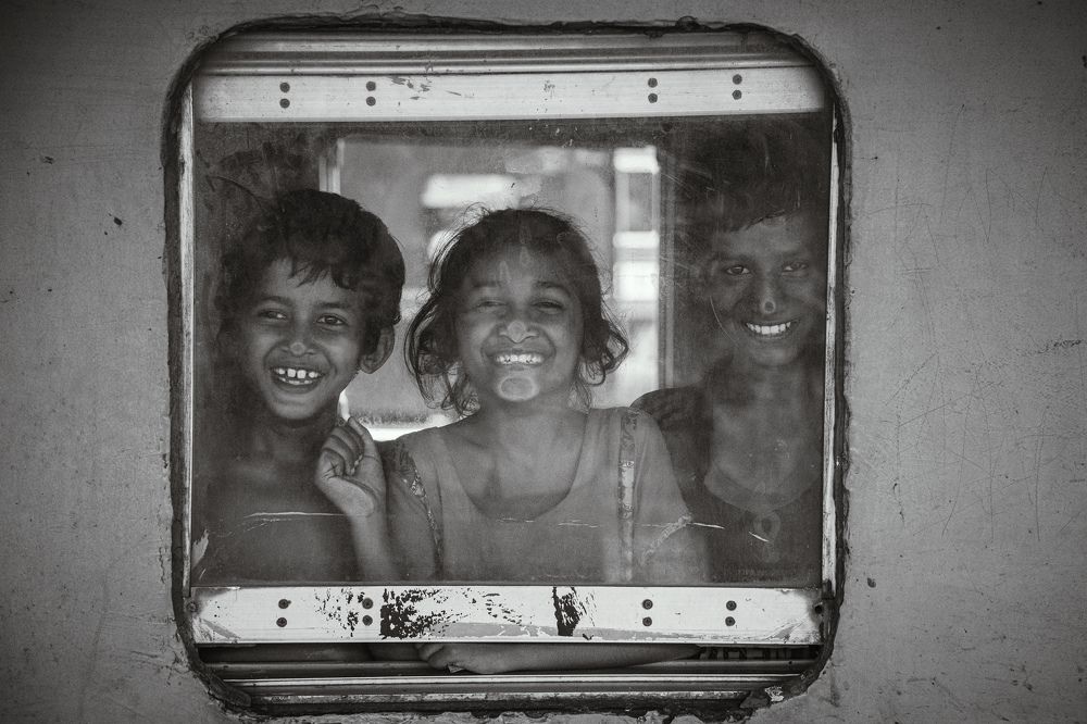 Happy faces on the window glass.