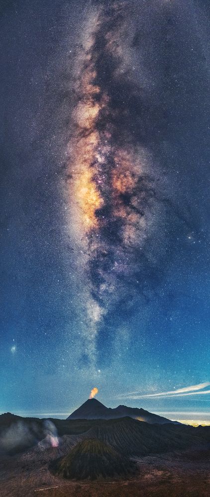 Mount Bromo erupting under the Milky Way