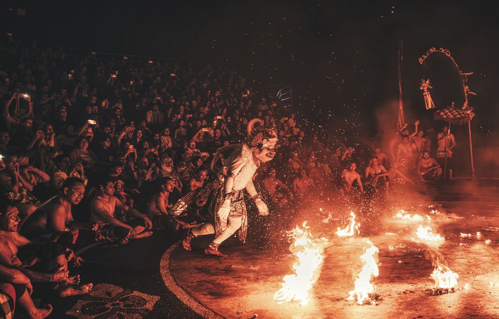 Kecak dancers rush towards the flames without fear