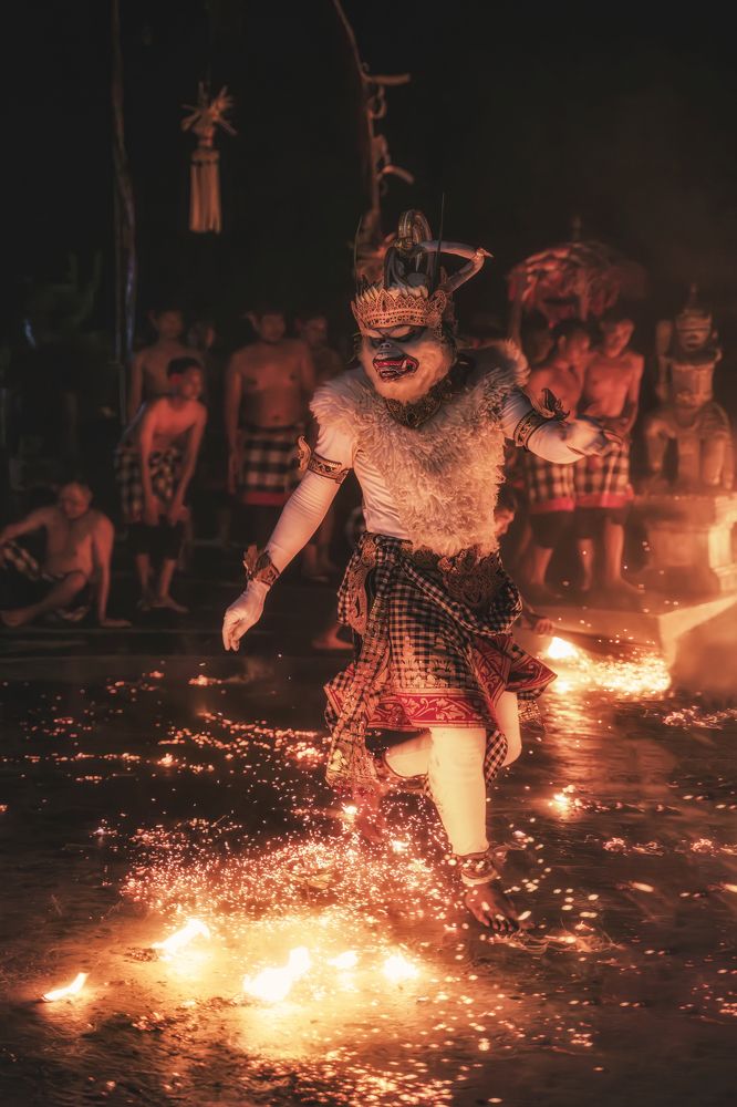 Kecak dancers rush towards the flames without fear