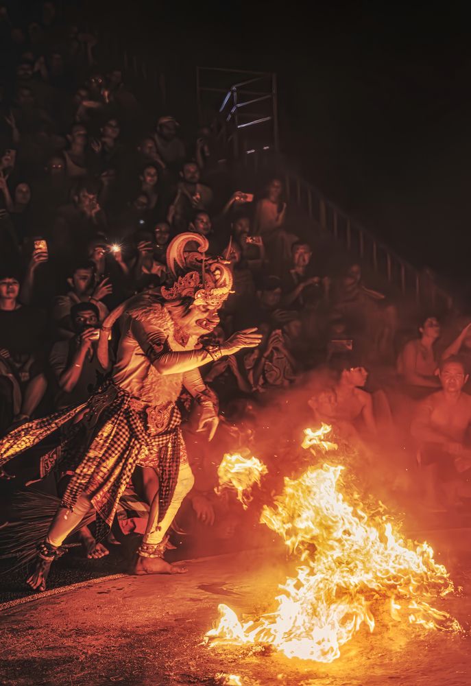 Kecak dancers rush towards the flames without fear