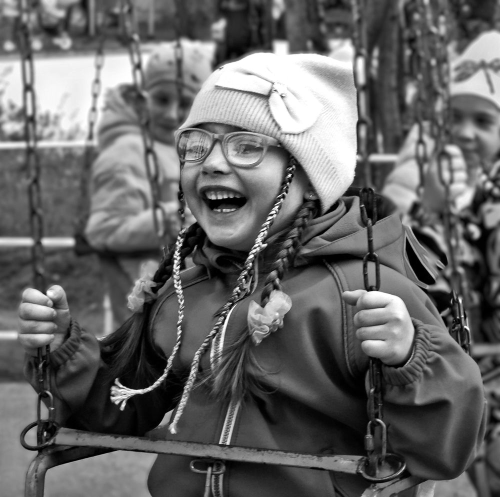 На каруселях.