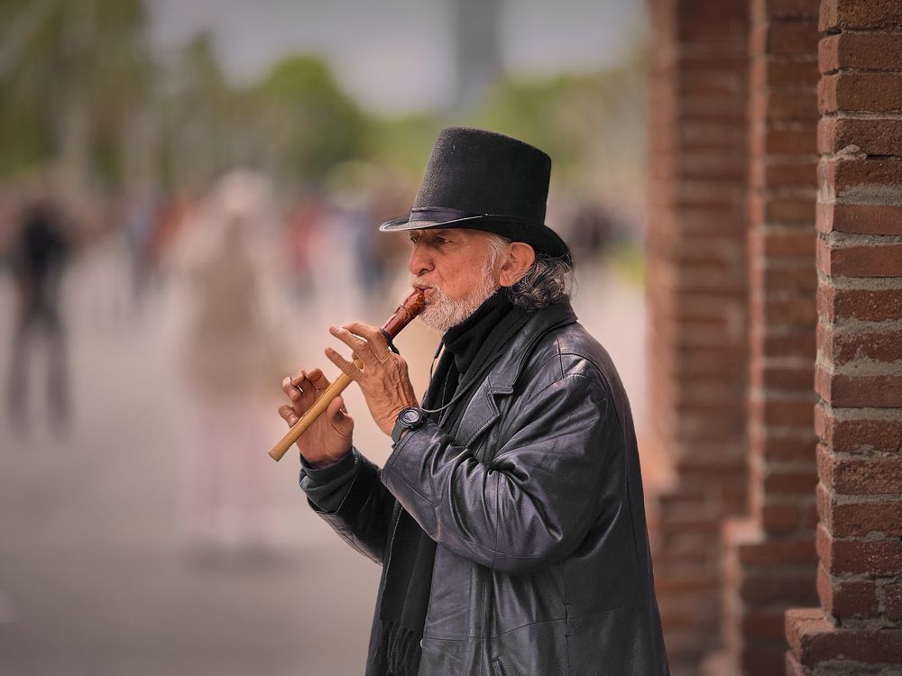 The flute player at the Arc de Triomf