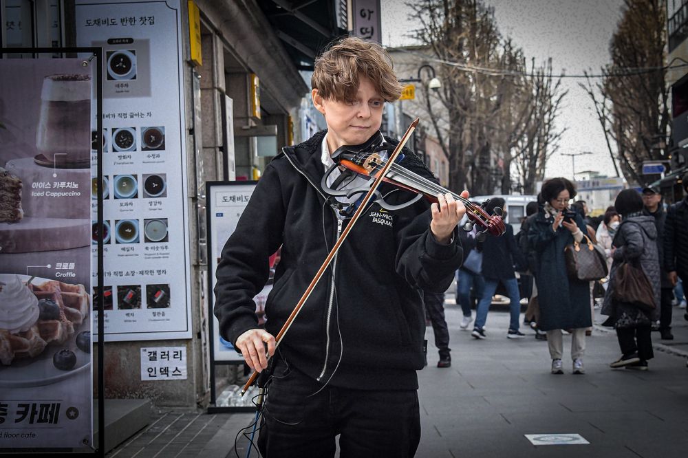 Young blond boy and his violin