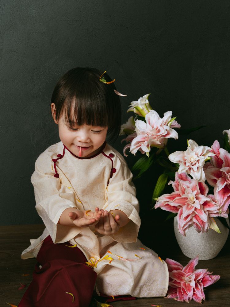 Vietnamese baby with lily flowers