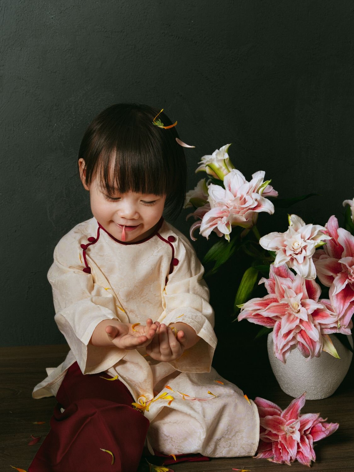 Vietnamese baby with lily flowers