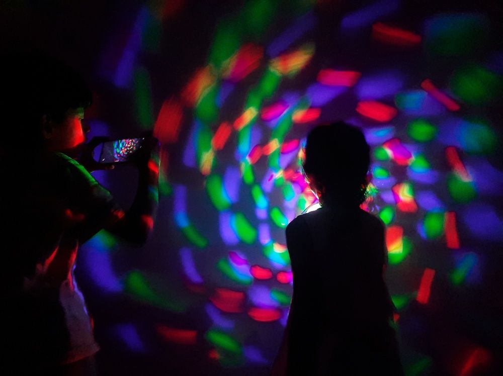 Siblings fun time - Light show makers and photographers!