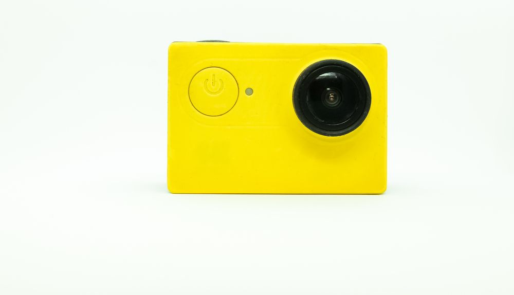 Compact digital camera in a yellow case