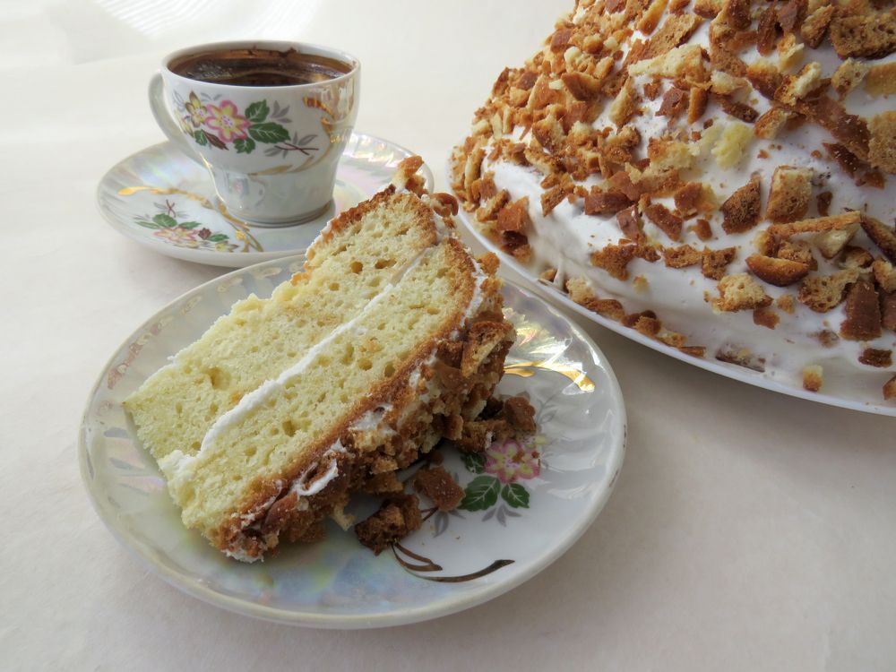 Porcelain coffee cup and sponge cake