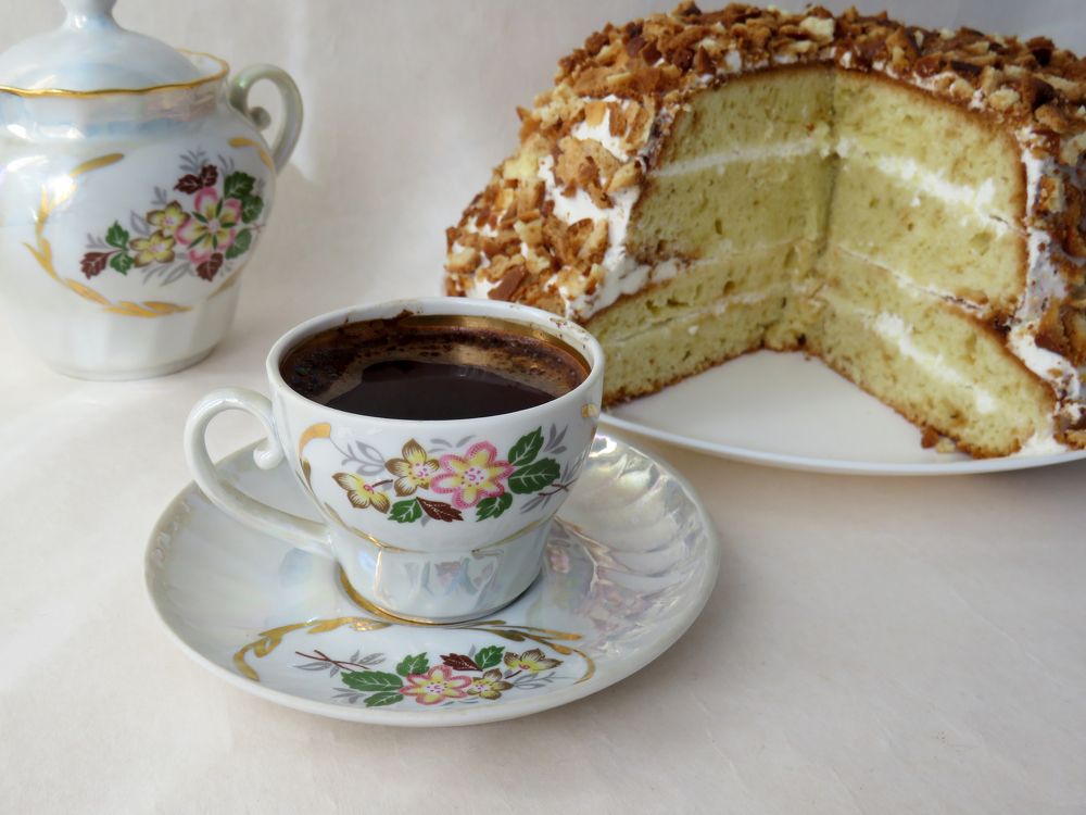 Porcelain coffee cup and sponge cake