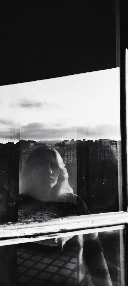 Self- portrait between the window and Barcelona