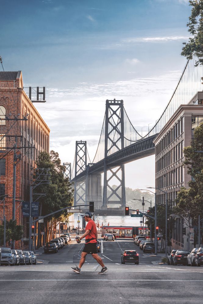 Passers-by in red doing morning exercises on the streets of San Francisco