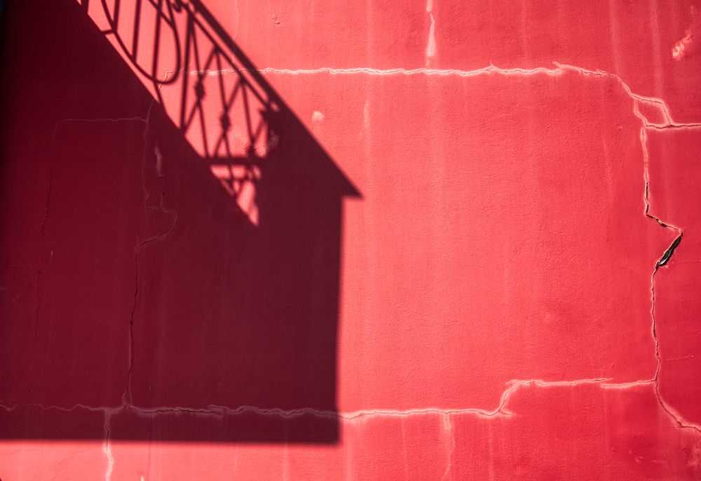 Shadow on red wall