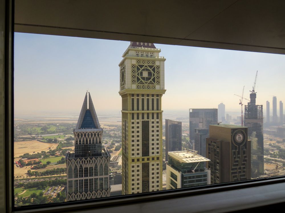 View of Dubai buildings through the window