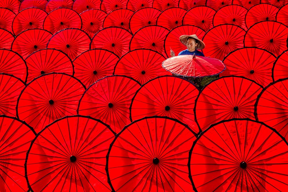 Drying The Red Umbrellas
