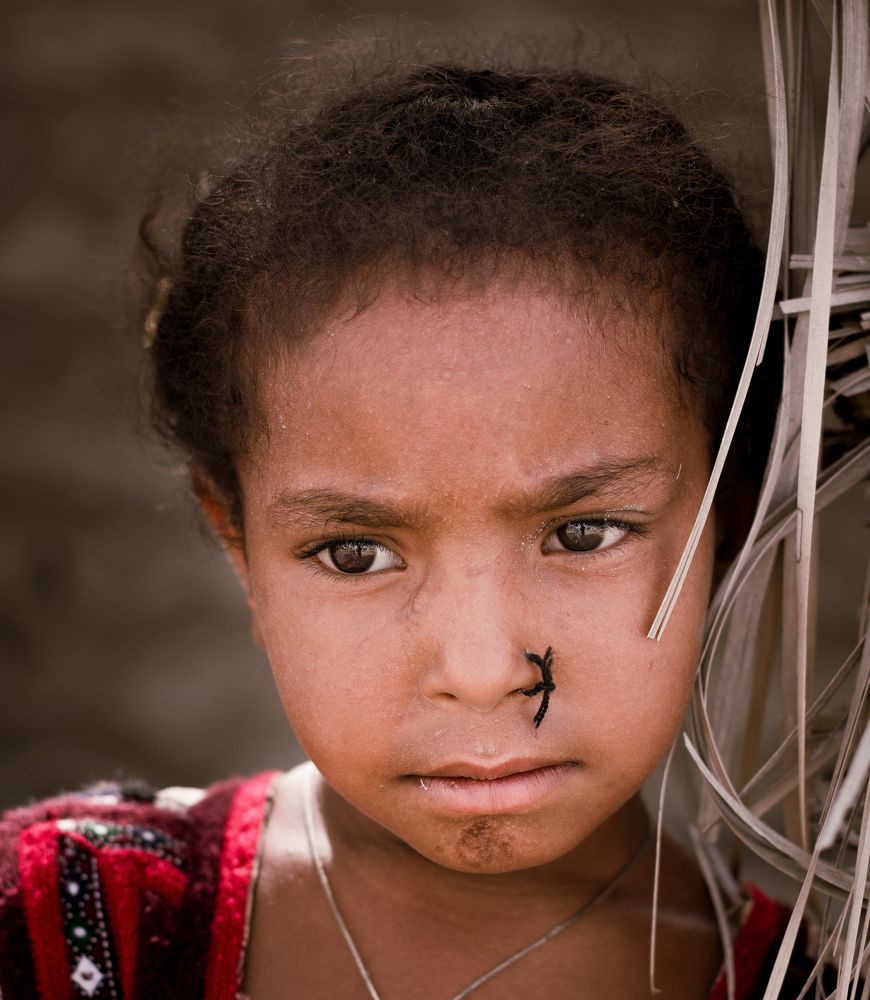 A child is expressing her dreams through her eyes.