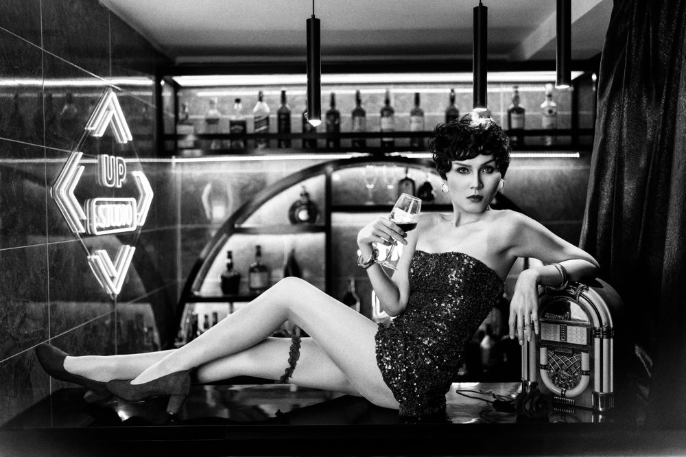 Betty Boop drinking at bar