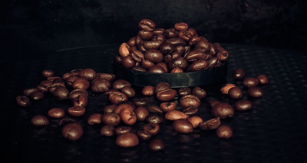 A small handful of roasted coffee beans