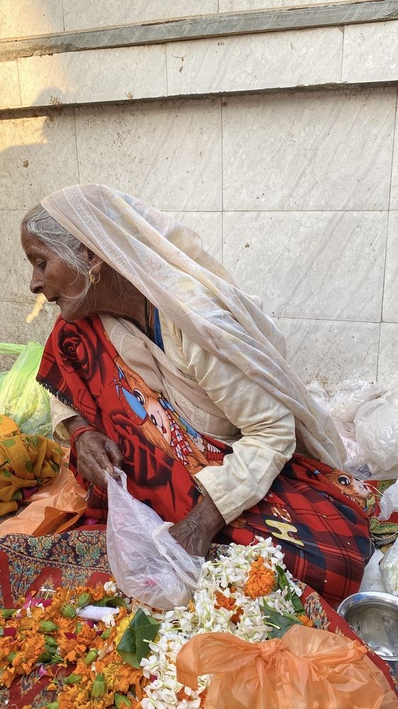 Flowers Saleswoman On the street of Vrindavan
