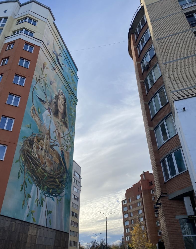 Graffiti girl on the wall of the house