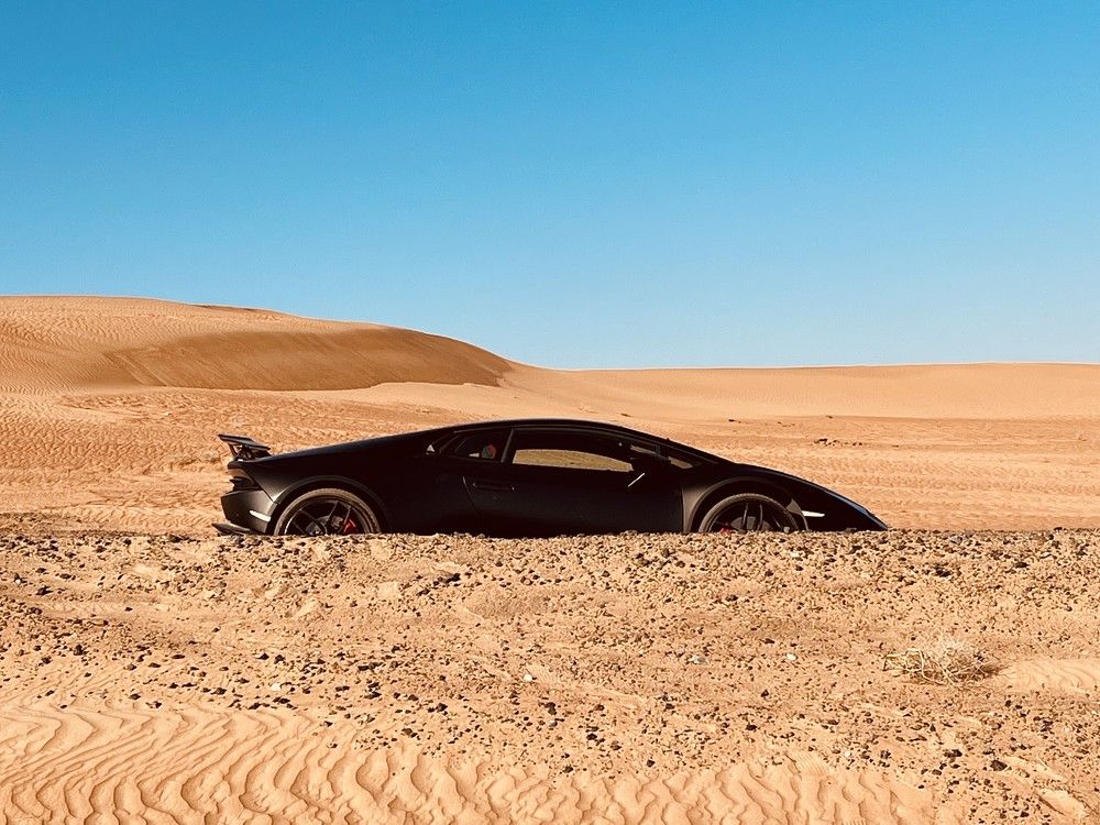 Sport car in a wild desert