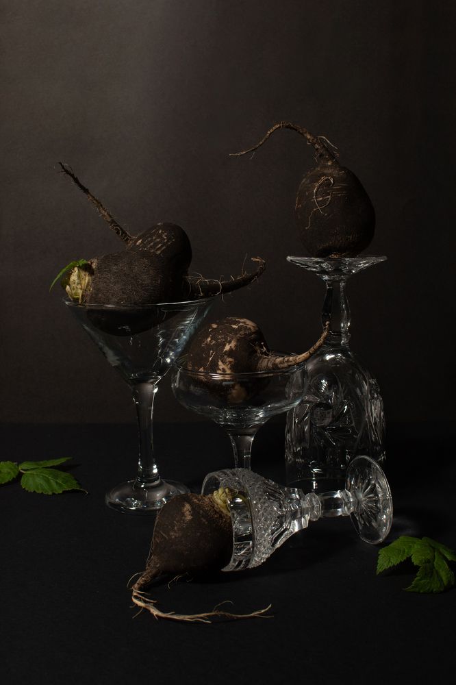 Black radishes in glasses.