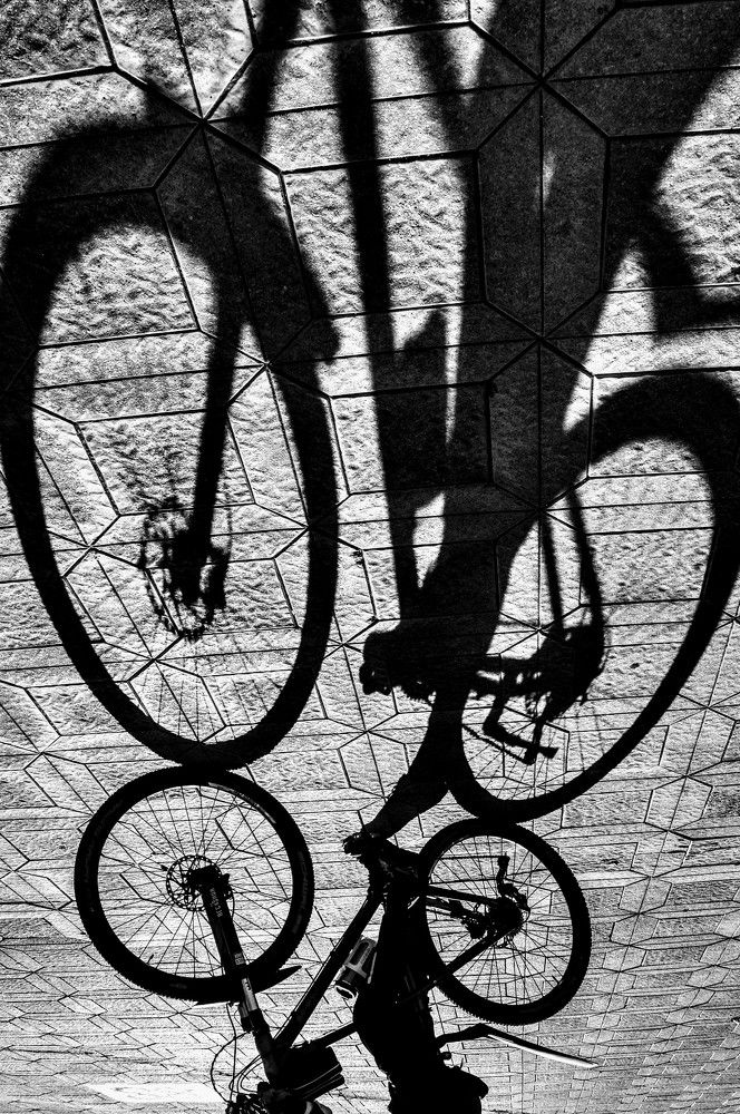 Dominant shadow on the cyclist