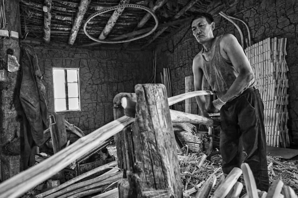 Portrait of a man, manifactoring a yurt