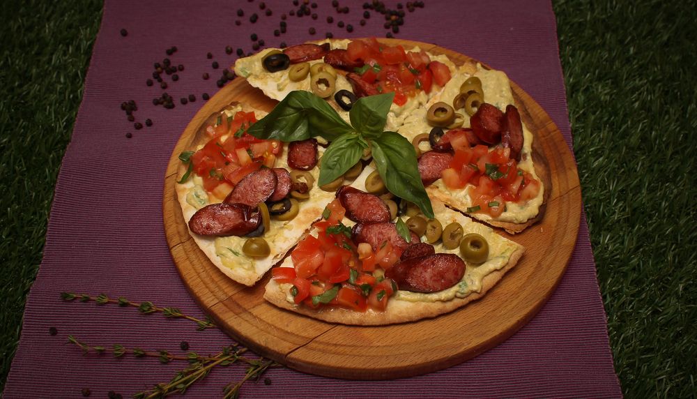 Lazy pizza divided into four parts