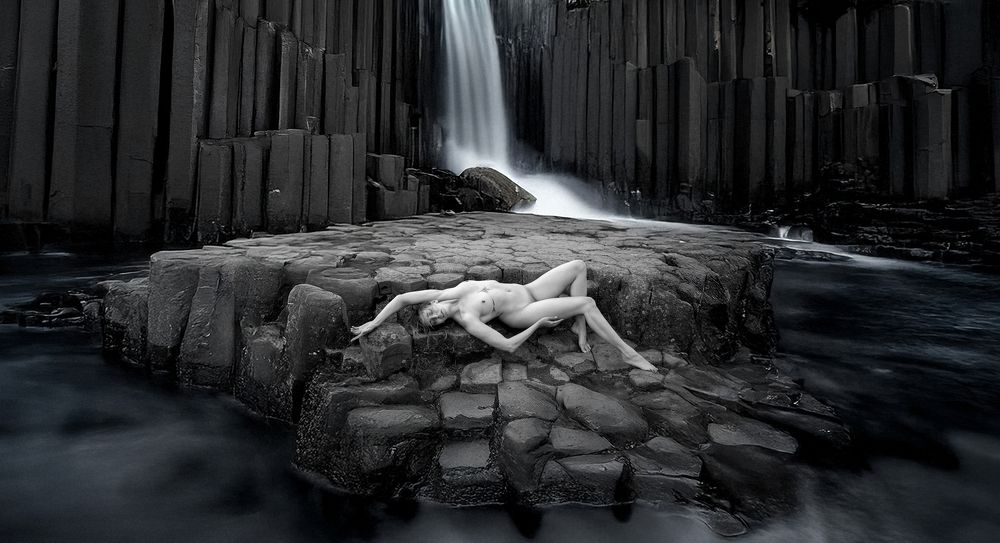 Resting in front of a waterfall in Iceland