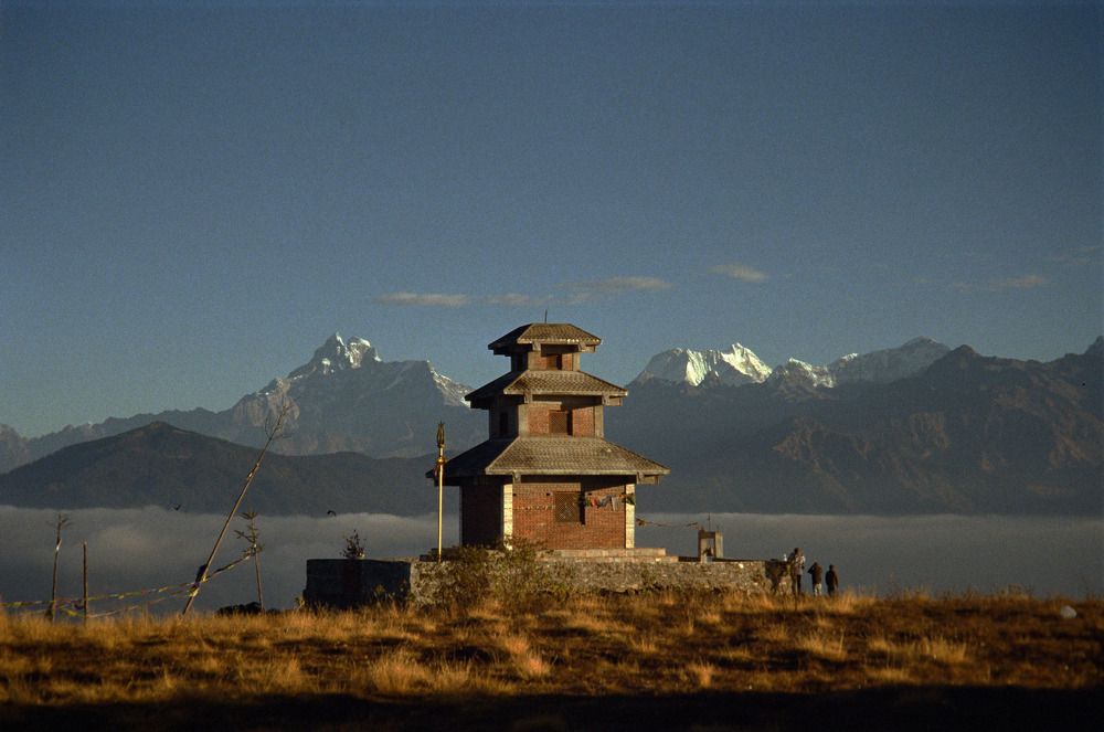Sunrise Over the Himalayas: A Temple Above the Clouds