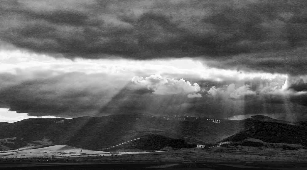 The play of clouds with the sun's rays