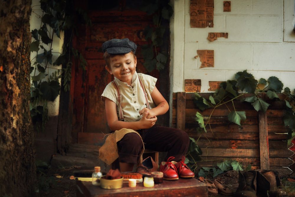 A cute little shoe shine boy.