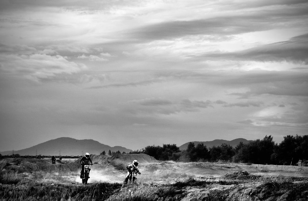 black and white motorbike racing in nature
